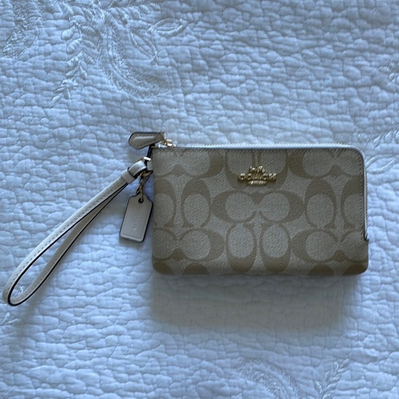 Coach Handbags - Coach Signature coated Leather Wristlet
